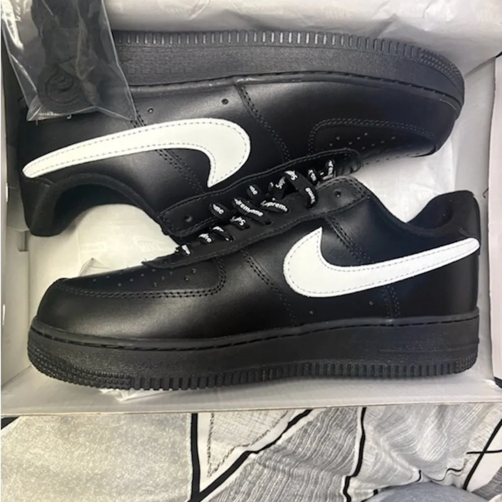 Supreme Black Sneakers with White Swoosh